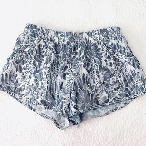 Grey and white ruffle running shorts